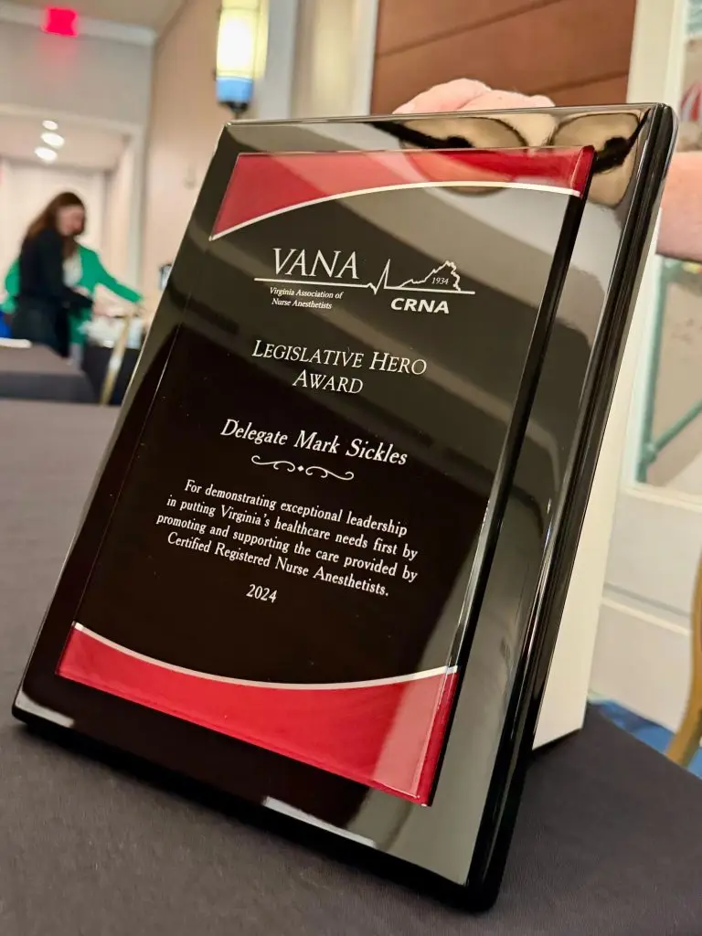 Legislative Hero Award plaque honoring Delegate Mark Sickles from VANA for healthcare and nurse anesthetist leadership, on a table.